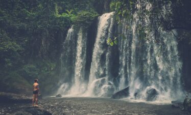 A man at the waterfall, Phnom Koulen at Siem Reap, Cambodia