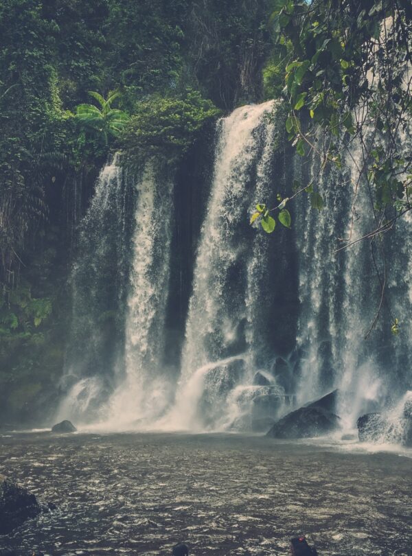 A man at the waterfall, Phnom Koulen at Siem Reap, Cambodia