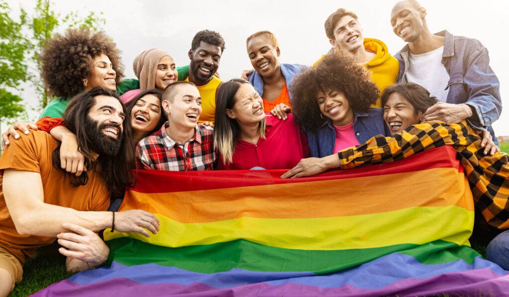 Happy diverse young friends celebrating gay pride day - LGBTQ community concept