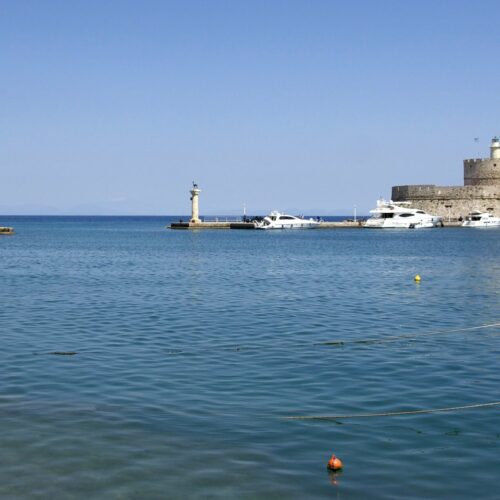 Mandraki Harbour and waterfront in Rhodes, Greece